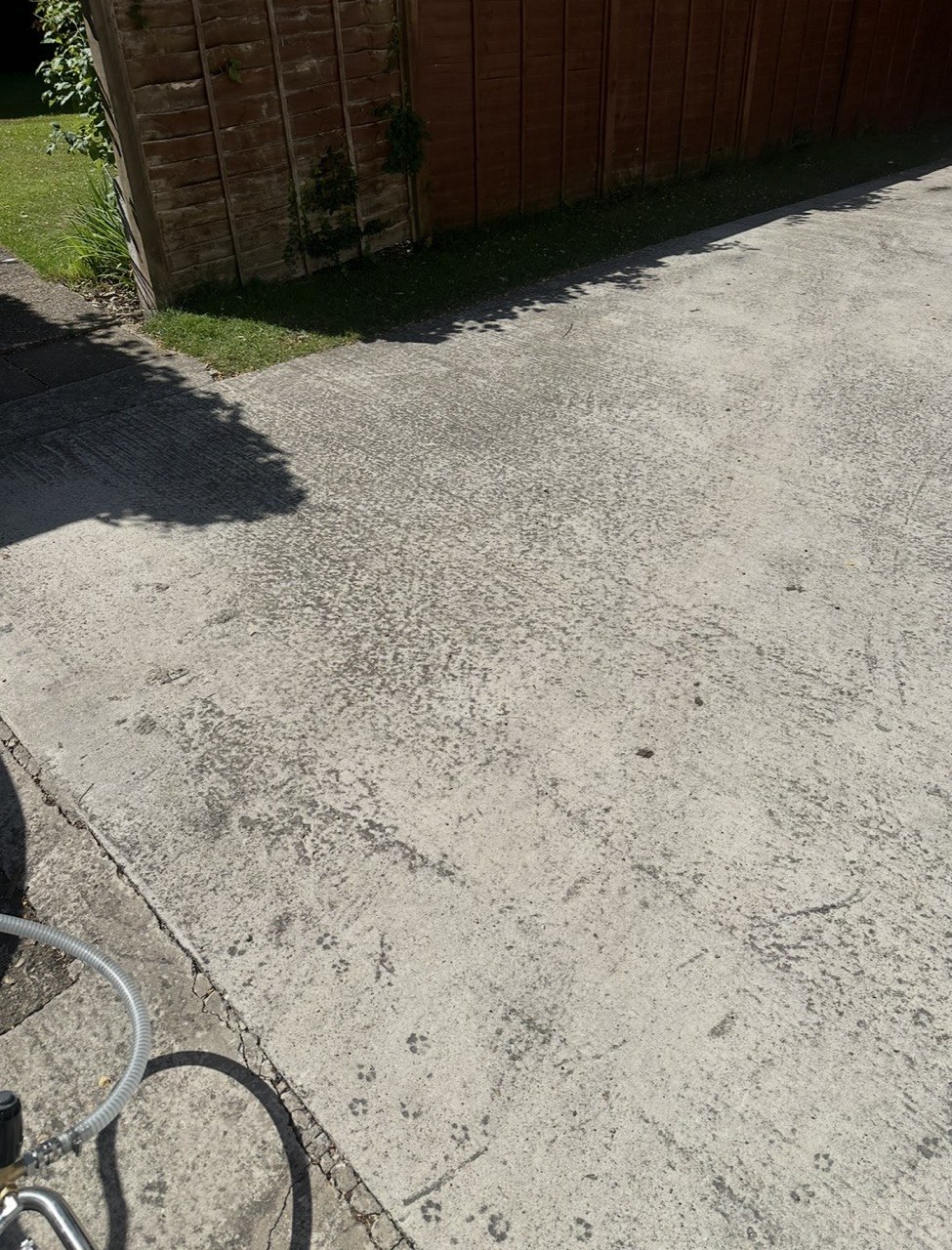 Clean concrete driveway after